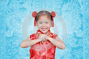 Cute asian kid girl in Traditional Chinese dress on Chinese seamless pattern, Chinese new year concept