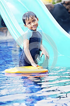 Cute Asian Kid Posing at Swimming Pool