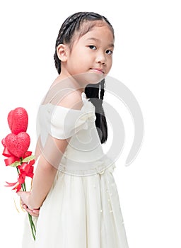 Cute asian little bridesmaid holding heart flower isolated