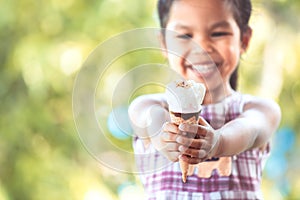 Cute asian little child girl holding delicious icecream cone