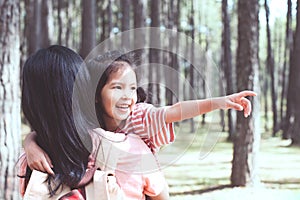 Cute asian little child girl hugging her mother with love