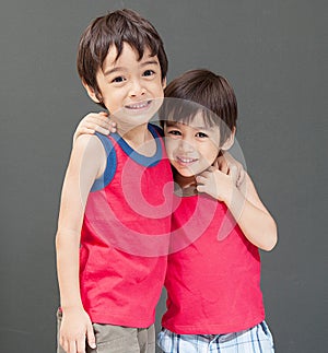 Cute Asian sibling smiling happy