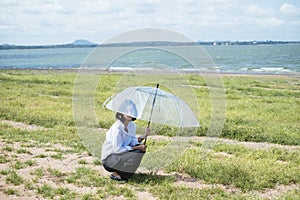 Cute asian woman and umbrella