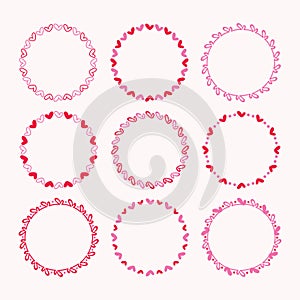Cute assorted red and pink empty cartoon heart shape round emblem borders design elements icons set on light pink