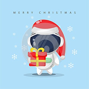 cute astronaut carrying a gift box on christmas day