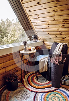 Cute autumn home decor arrangement on wood timber cabin balcony.