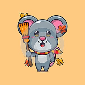 Cute autumn mouse holding broom.