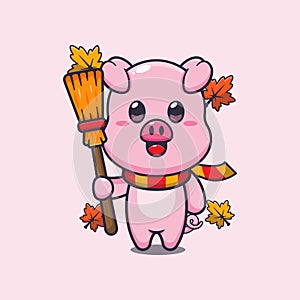 Cute autumn pig holding broom.