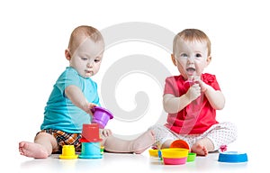 Cute babies playing with color toys. Children girl