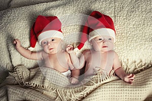 Cute babies with santa hats