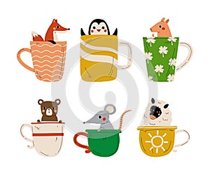 Cute baby animals sitting inside cups set. Adorable fox, penguin, piglet, bear, rat, lamb in cup cartoon vector