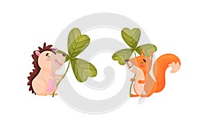 Cute baby animals with three leaf clover set. Adorable hedgehog, squirrel holding shamrock leaves cartoon vector