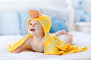 Cute baby after bath in yellow duck towel