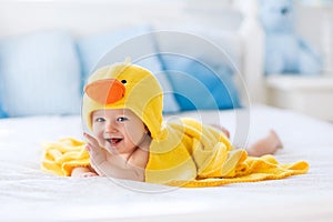 Cute baby after bath in yellow duck towel