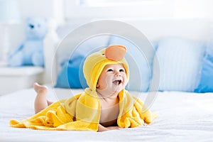 Cute baby after bath in yellow duck towel