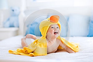 Cute baby after bath in yellow duck towel