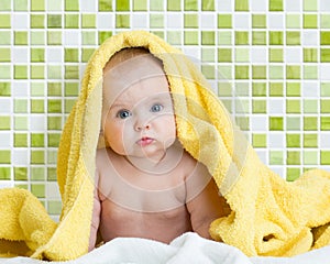 Cute baby in bathing towel