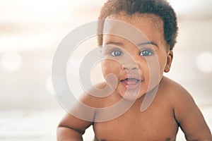 Cute baby, black kid and happy portrait with bokeh, mockup and space in nursery room, happiness and relax. Young infant