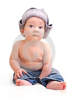 Cute baby boy in cap with ear-flaps