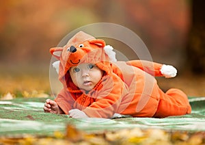 Cute baby boy dressed in fox costume