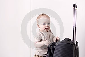 Cute baby boy ready for a crusie. Smiling infant kid going to a trip. Copy space