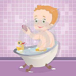 Cute baby boy smiling while talking a bath in bathroom