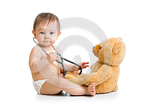Cute baby boy weared diaper with stethoscope and toy photo
