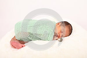 Cute baby boy in wrap - born with silver spoon