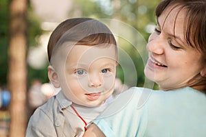 Cute baby boy less 1 year with his mom