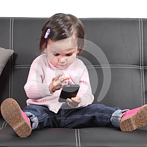 Cute baby browsing in a smartphone photo