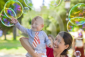 Cute Baby Catching Soap Bubbles