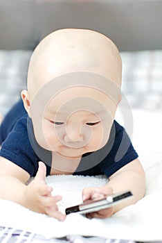 Cute baby with cellphone