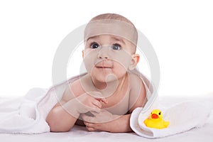 Cute baby child after shower with yellow duck
