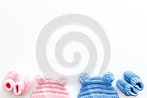 Cute baby clothes for girl and boy on white background top view copyspace