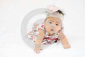 Cute baby confusing girl with rose headband