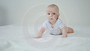 Cute Baby Crawling on Her Bed at Home