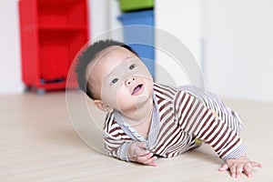 Cute Baby crawling on livingroom floor