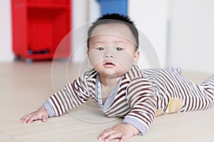 Cute Baby crawling on livingroom floor