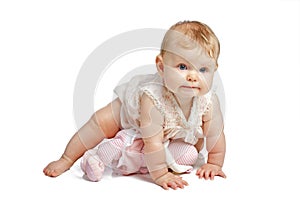 Cute baby crawling in sleeveless sundress