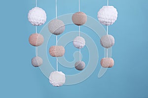 Cute baby crib mobile on light blue background