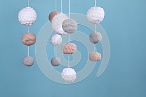 Cute baby crib mobile on light blue background