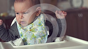 Cute baby does not want to eat her food spoon fed mother problem solids slow motion