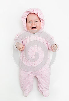 Cute baby dressed in warm overall for winter cold weather.