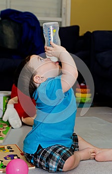 Cute Baby drinking from a bottle