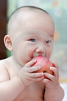 Cute baby eat apple