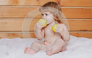 Cute baby eat apple. Funny baby eat apples. Kid eating fruit. Healthy nutrition for kids. Solid food for infant.