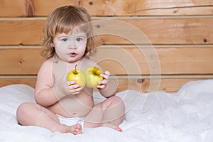 Cute baby eat apple. Solid food for infant. Child eating, nutrition concept.