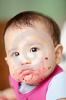 Cute Baby After Eating Fruit looking at the camera