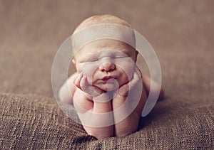 Cute baby on elbows photo