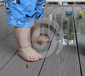 Cute baby feet in summer